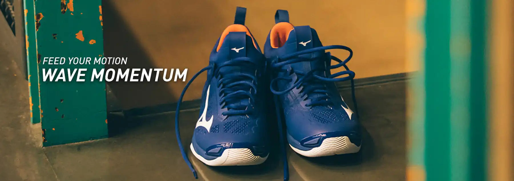 Blue and orange athletic shoes with white soles.