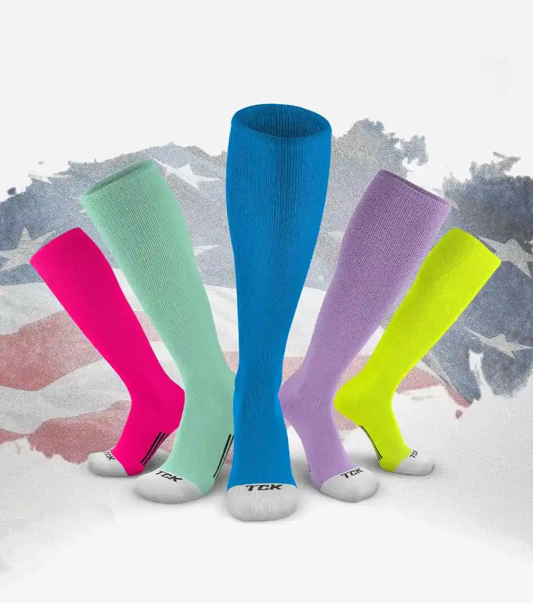 Brightly colored athletic knee-high socks in neon pink, mint green, royal blue, lavender, and lime yellow with white soles featuring the ’tck’ logo.