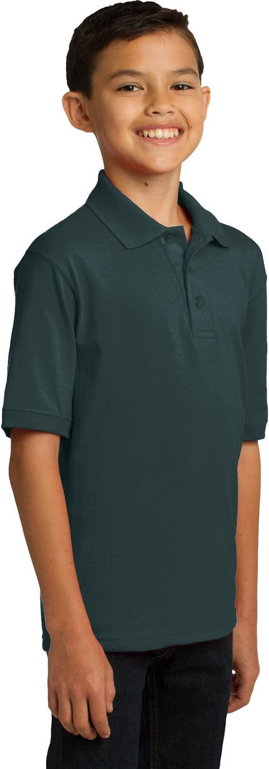 Dark Green Port & Co Youth Core Blend Jersey Knit Polo. KP55Y