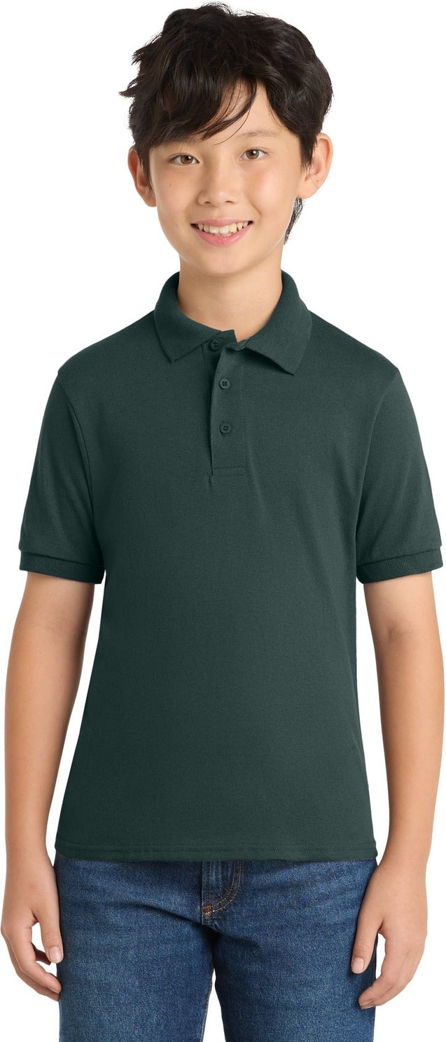 Front View of Dark Green Port & Co Youth Core Blend Jersey Knit Polo. KP55Y