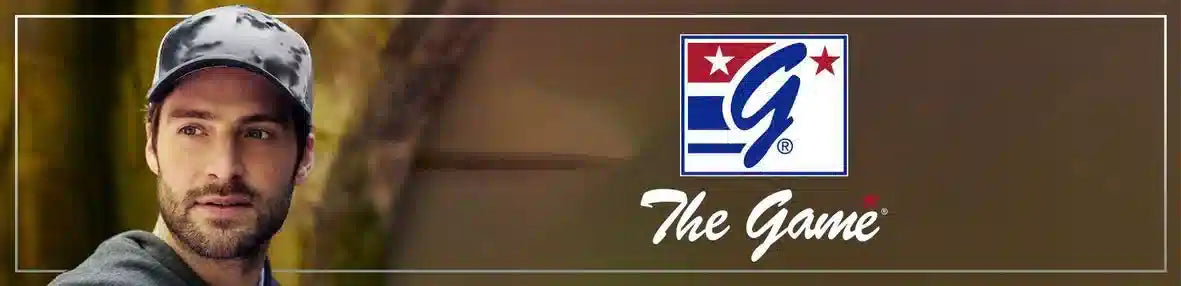 A man wearing a camouflage-patterned baseball cap with the logo ’the game’ displayed prominently beside him.