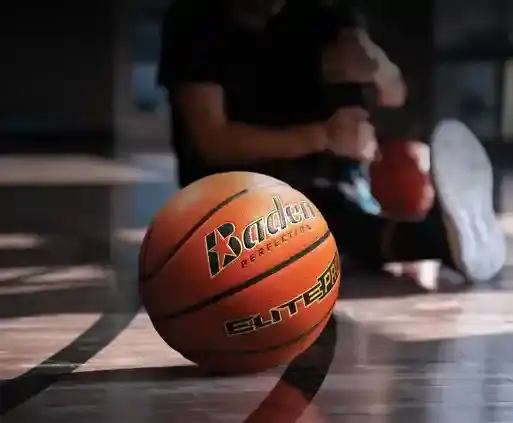Orange baden elite pro basketball with black and yellow lettering.