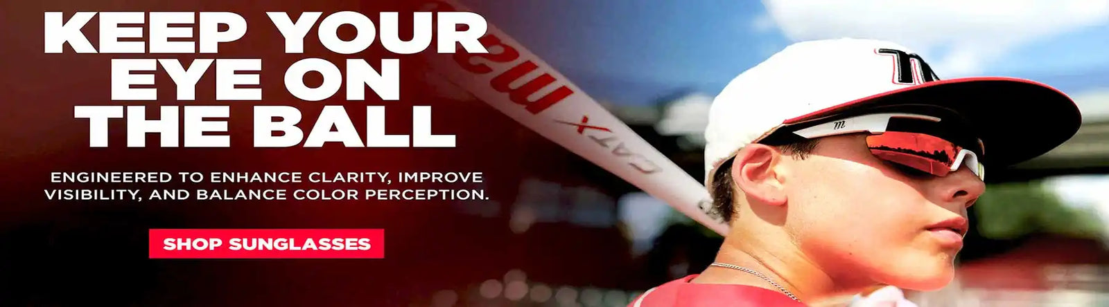 A young baseball player wearing protective sunglasses.